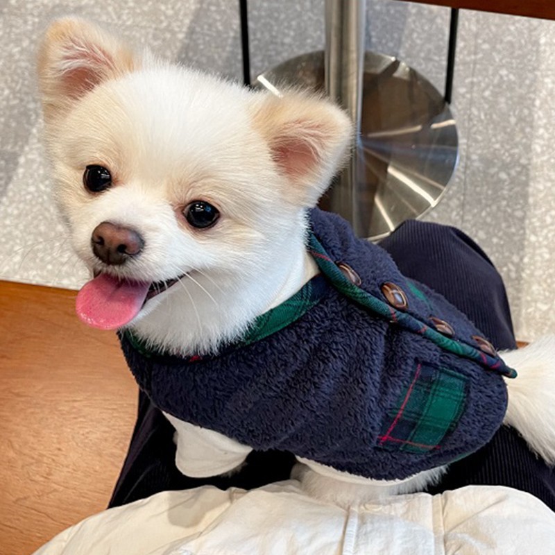 Navy plaid fleece pet vest worn by a small dog